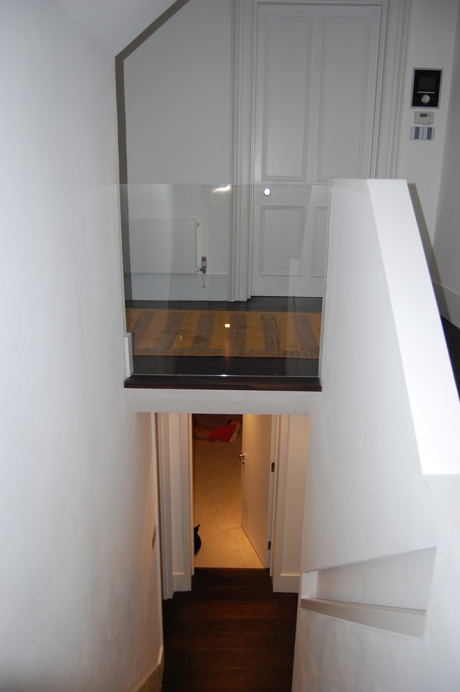 Inspiration for a medium sized contemporary wood u-shaped staircase in London with wood risers.