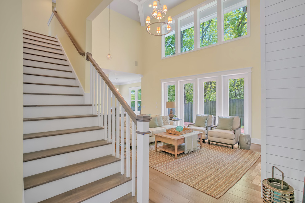 Inspiration for a mid-sized transitional wooden straight wood railing staircase remodel in Other with painted risers