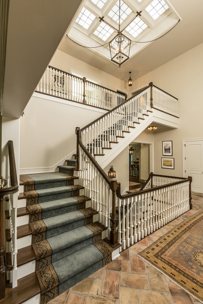 Design ideas for a classic wood l-shaped staircase in Milwaukee with painted wood risers.