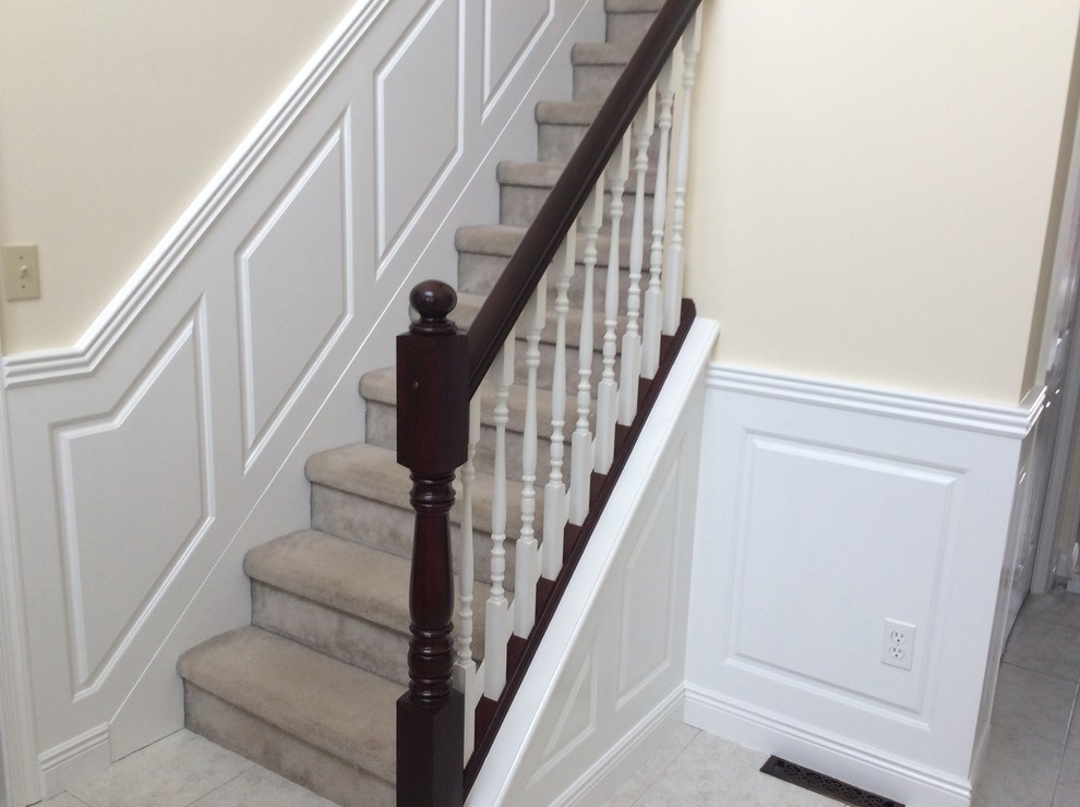 Mid-sized transitional carpeted straight wood railing staircase photo in Other with carpeted risers