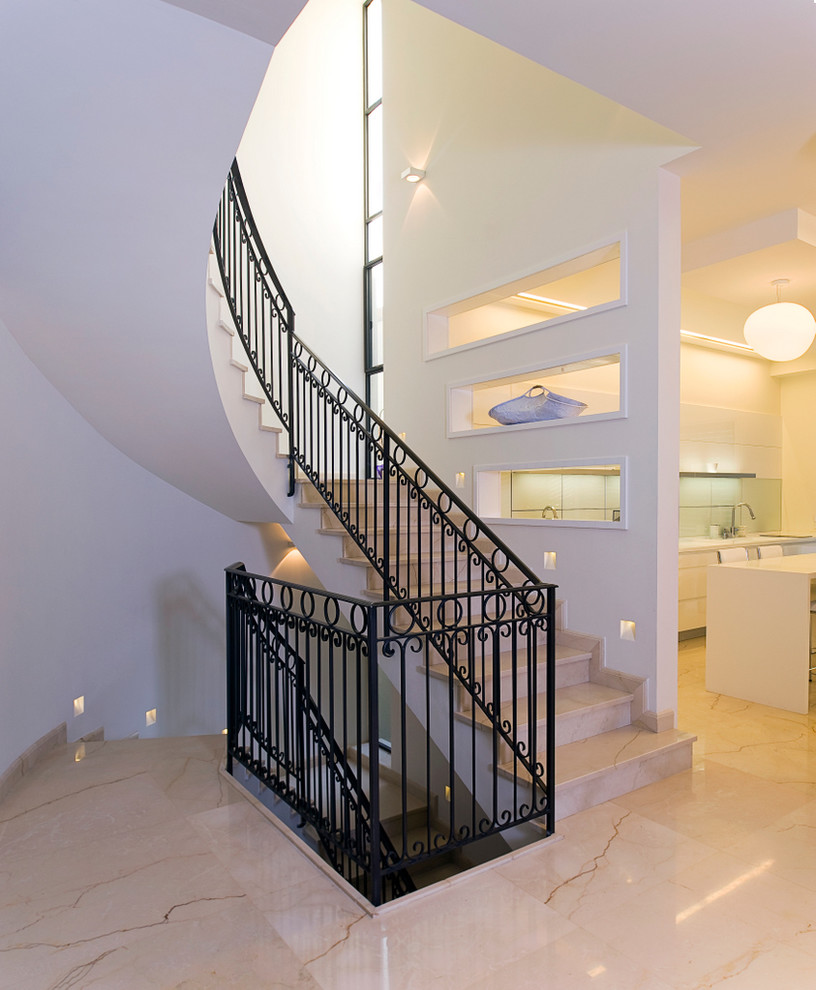 Staircase - contemporary curved staircase idea in Other