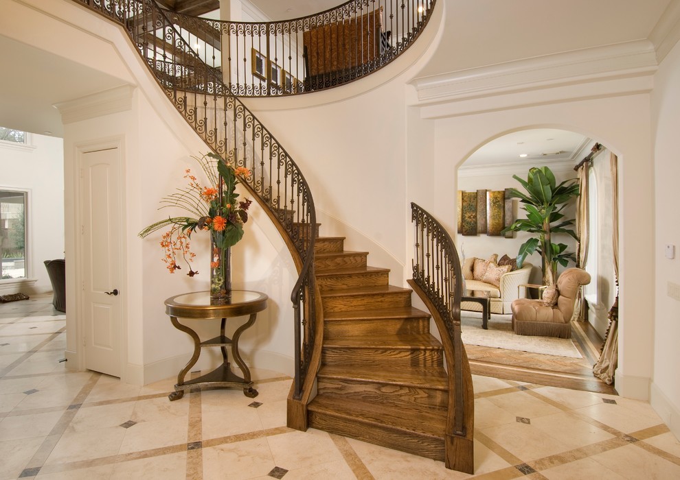 This is an example of a mediterranean curved staircase in Houston.
