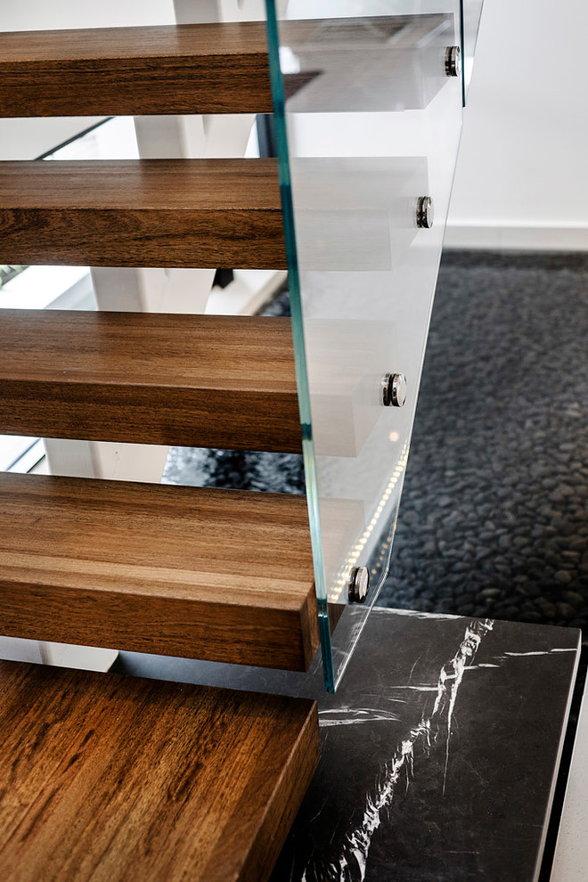 Inspiration for a contemporary wooden staircase remodel in Perth