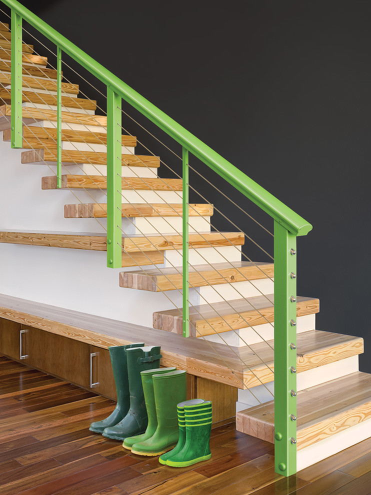 Inspiration pour un escalier sans contremarche minimaliste avec des marches en bois.