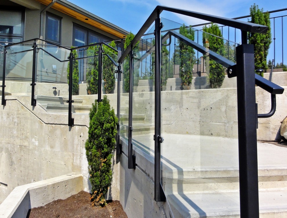 Источник вдохновения для домашнего уюта: изогнутая бетонная лестница среднего размера в современном стиле с бетонными ступенями