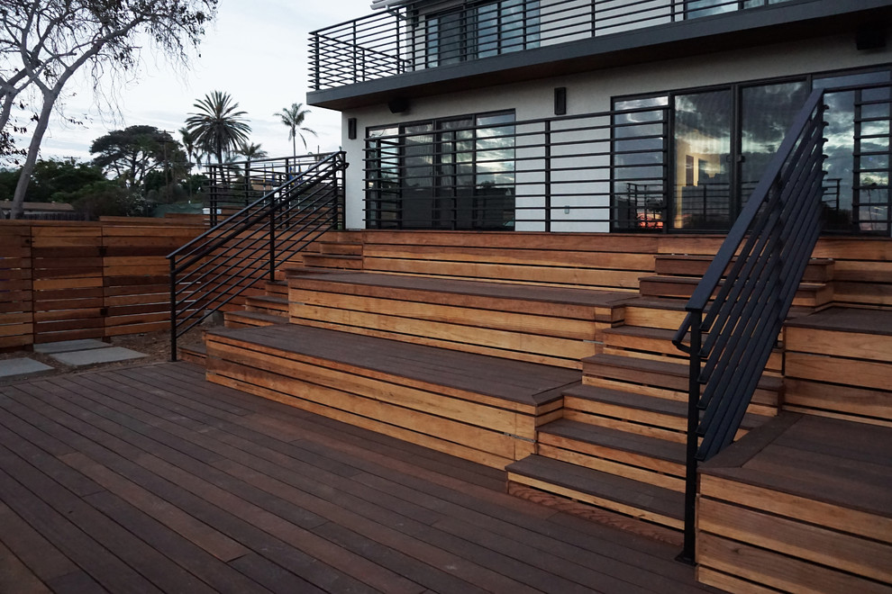 Inspiration for an expansive contemporary wood straight staircase in San Diego with wood risers.