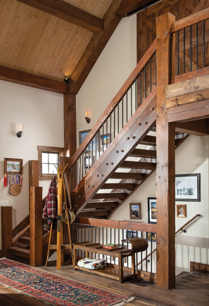 Пример оригинального дизайна: угловая лестница в стиле рустика с деревянными ступенями и перилами из смешанных материалов без подступенок