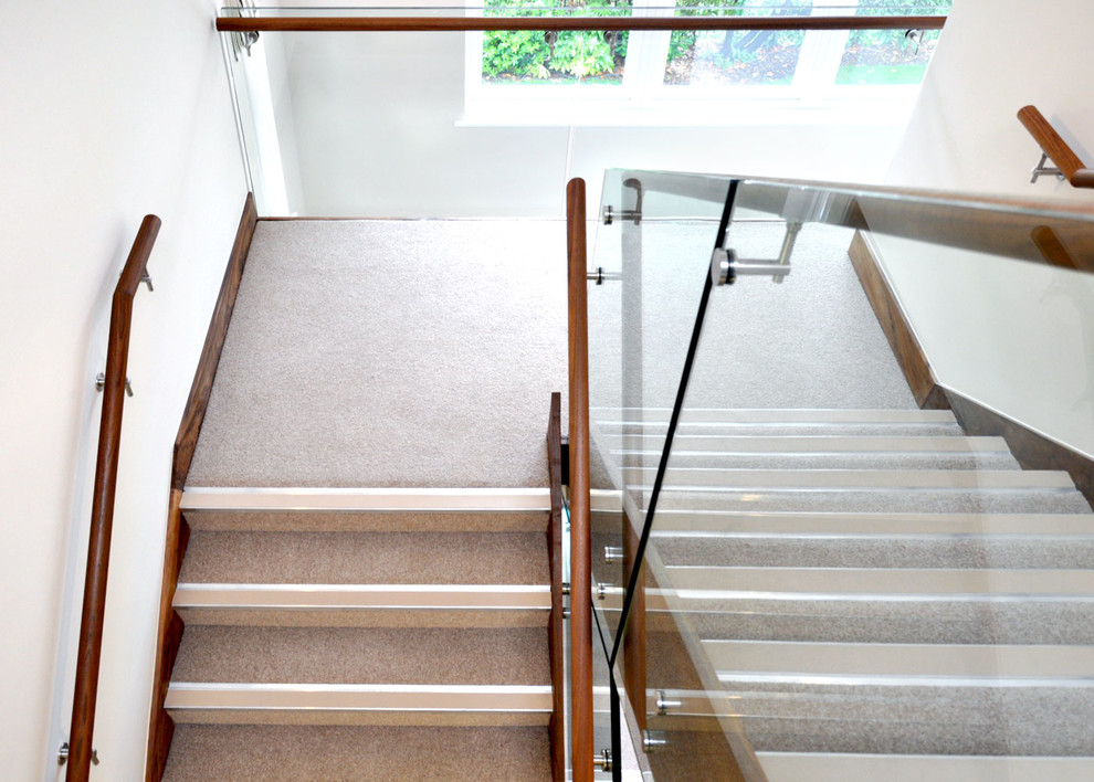 Design ideas for a medium sized modern concrete straight mixed railing staircase in Buckinghamshire with concrete risers.