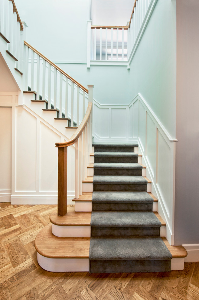 Design ideas for a medium sized classic wood u-shaped staircase in Melbourne with painted wood risers.