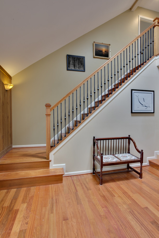 Photo of a medium sized classic wood l-shaped staircase in DC Metro with wood risers.