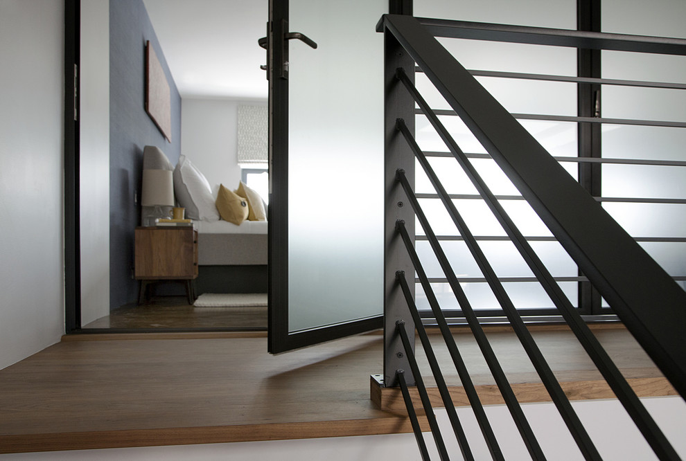 Contemporary wood floating staircase in Boston with open risers.