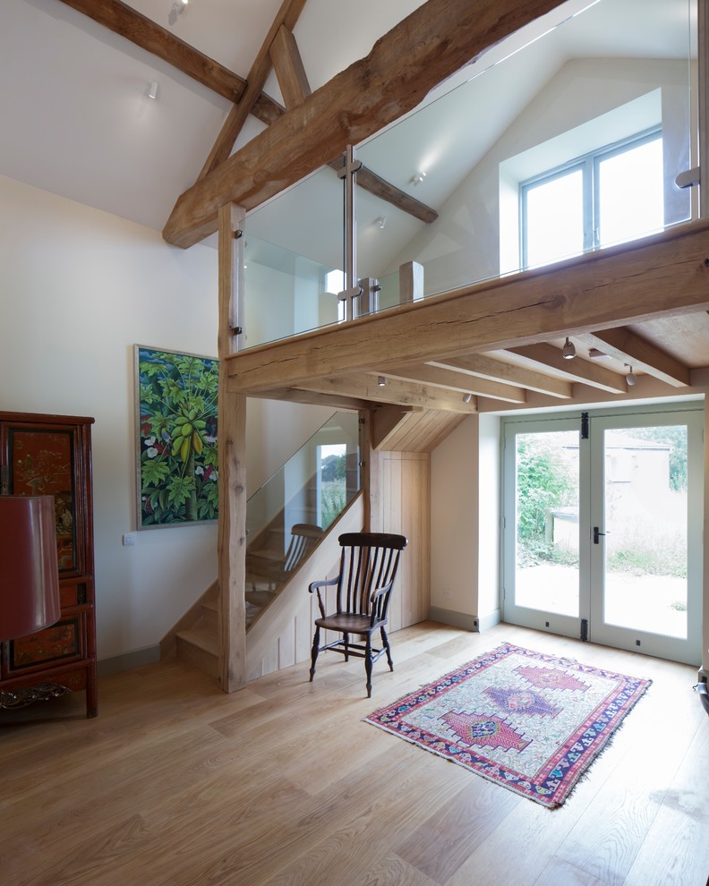 Example of a small farmhouse wooden l-shaped staircase design in Gloucestershire with wooden risers