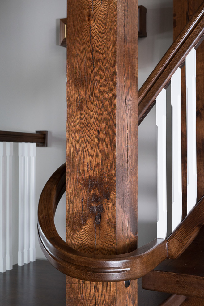 Inspiration for a large cottage wooden floating open and wood railing staircase remodel in Columbus