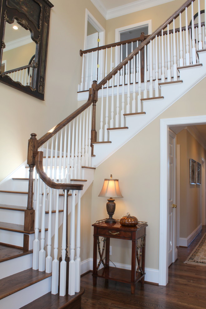 Staircase - large traditional wooden u-shaped staircase idea in Other with painted risers