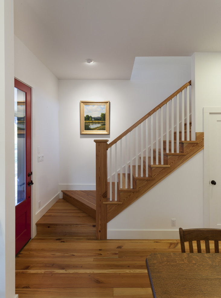 Inspiration for a farmhouse wooden staircase remodel in Austin with wooden risers
