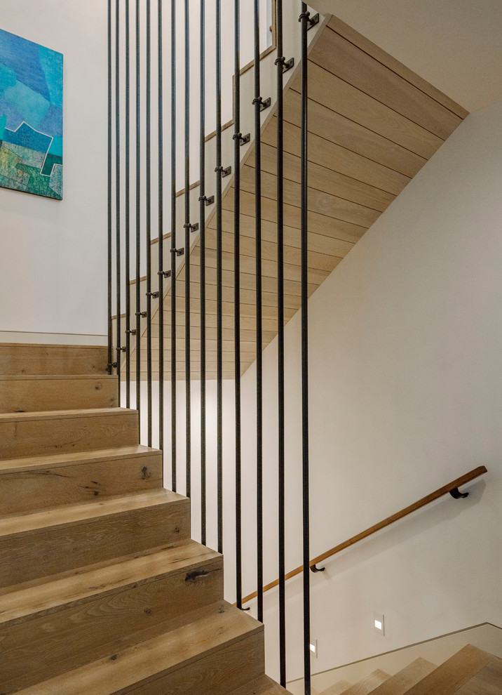 Example of a mid-sized farmhouse wooden u-shaped mixed material railing staircase design in Burlington with wooden risers