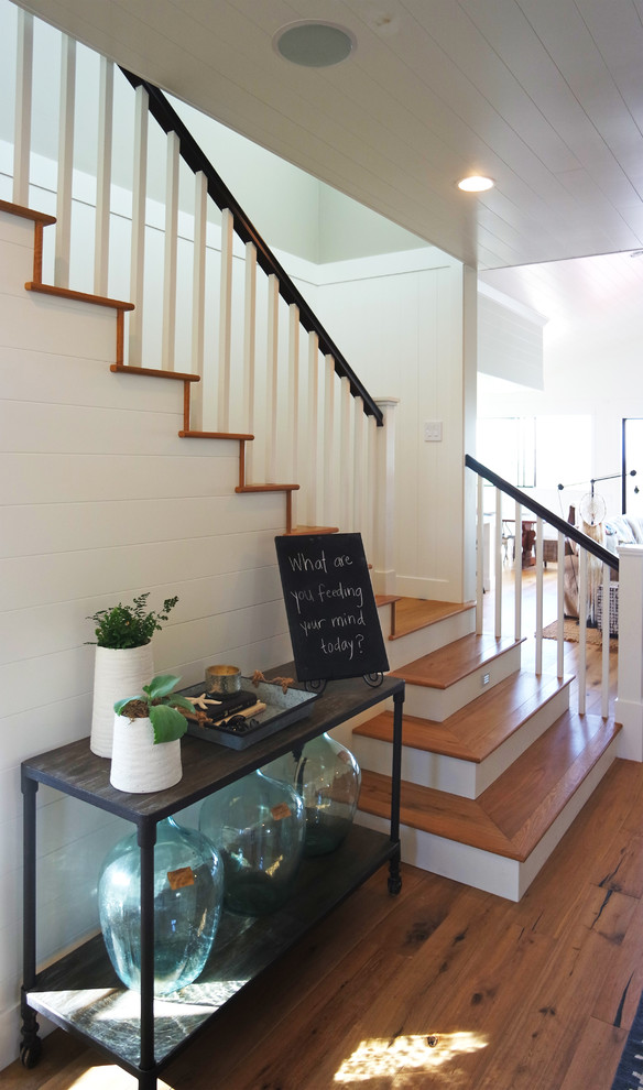 Example of a mid-sized cottage wooden l-shaped staircase design in San Diego with painted risers