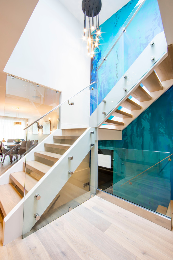 Staircase - contemporary wooden l-shaped open, glass railing and wallpaper staircase idea in Toronto