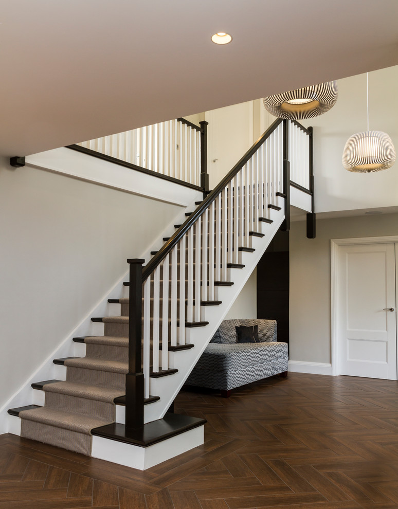 Staircase - huge contemporary carpeted straight wood railing staircase idea in Hertfordshire with carpeted risers