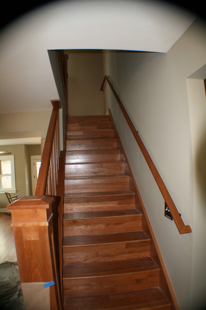 Staircase - craftsman wooden straight staircase idea in San Diego with wooden risers