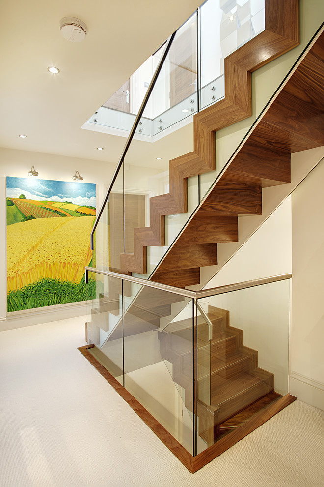 This is an example of a medium sized contemporary wood straight staircase in Other with wood risers.