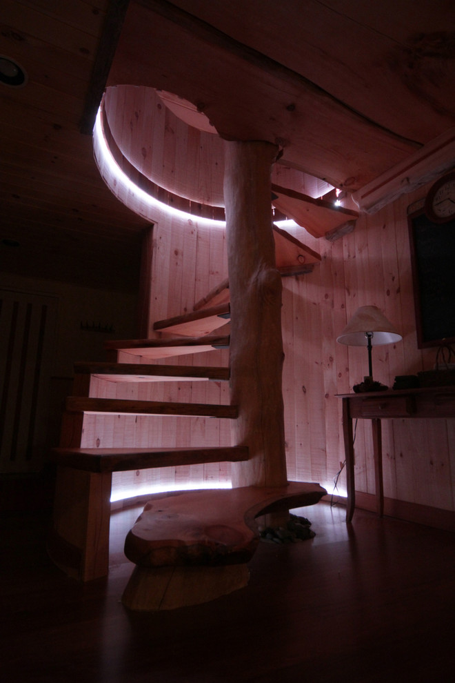 Exempel på en mellanstor rustik rak trappa i trä, med öppna sättsteg och räcke i trä