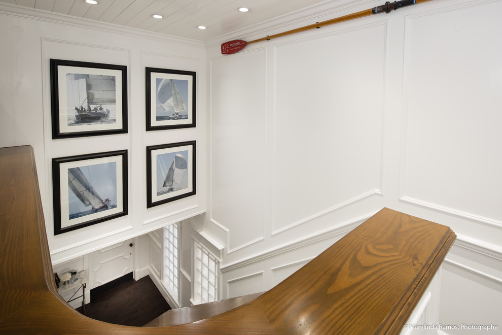 This is an example of a coastal wood wood railing staircase in Boston with wood risers.