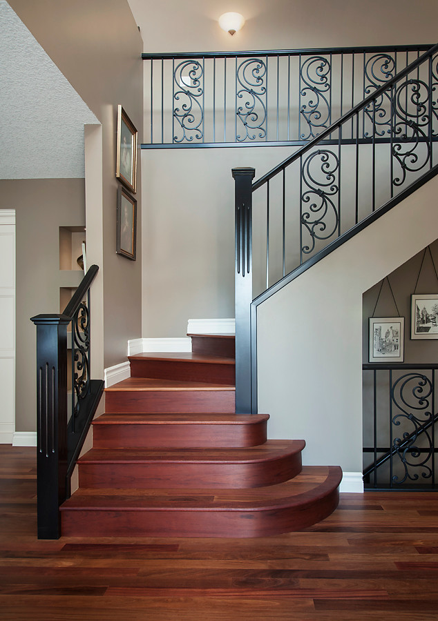 Example of a classic wooden l-shaped staircase design in Calgary with wooden risers