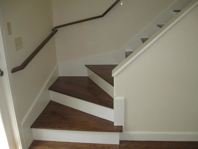 Example of a mid-sized classic wooden straight staircase design in Providence with painted risers