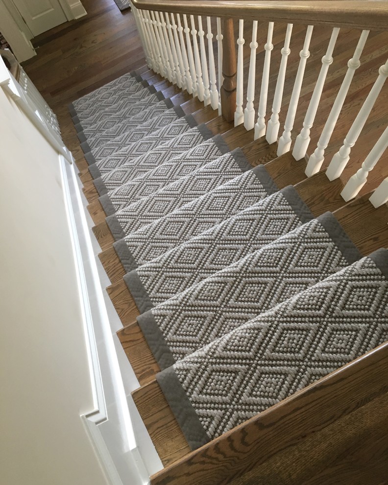 Inspiration for a medium sized traditional carpeted straight staircase in New York with carpeted risers.
