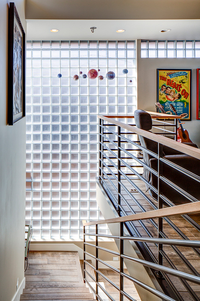 Photo of a contemporary wood u-shaped staircase in Portland with wood risers.