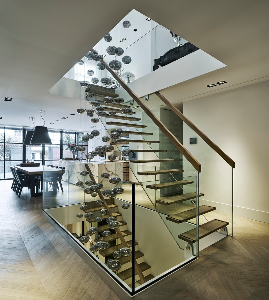 Inspiration for a contemporary wooden staircase remodel in Amsterdam