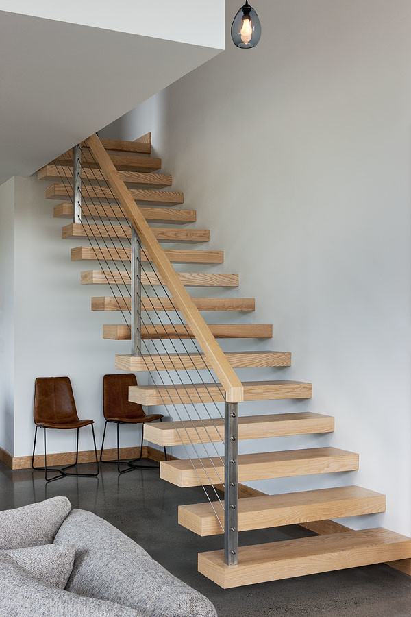 Design ideas for a medium sized modern wood floating mixed railing staircase in Other with open risers.