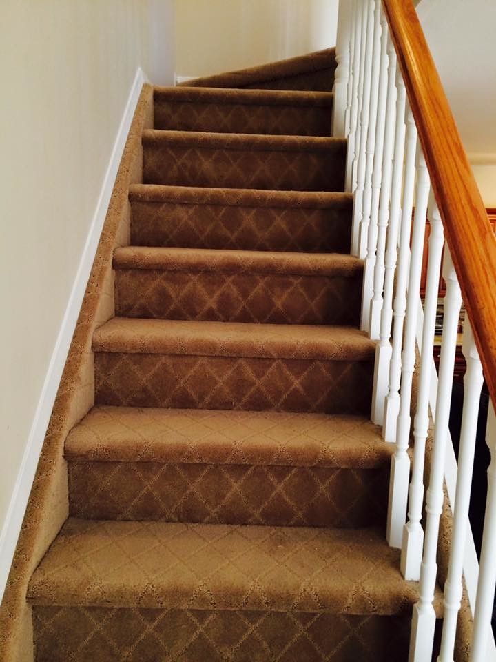 Design ideas for a medium sized classic carpeted straight staircase in New York with carpeted risers.