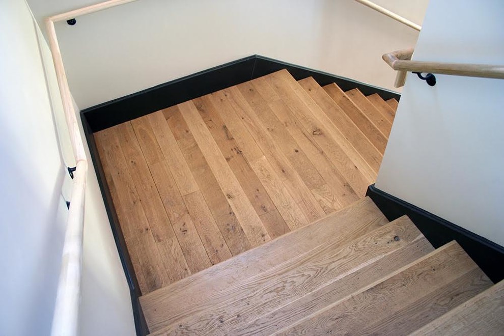 Inspiration for a mid-sized contemporary wooden l-shaped staircase remodel in Phoenix with wooden risers