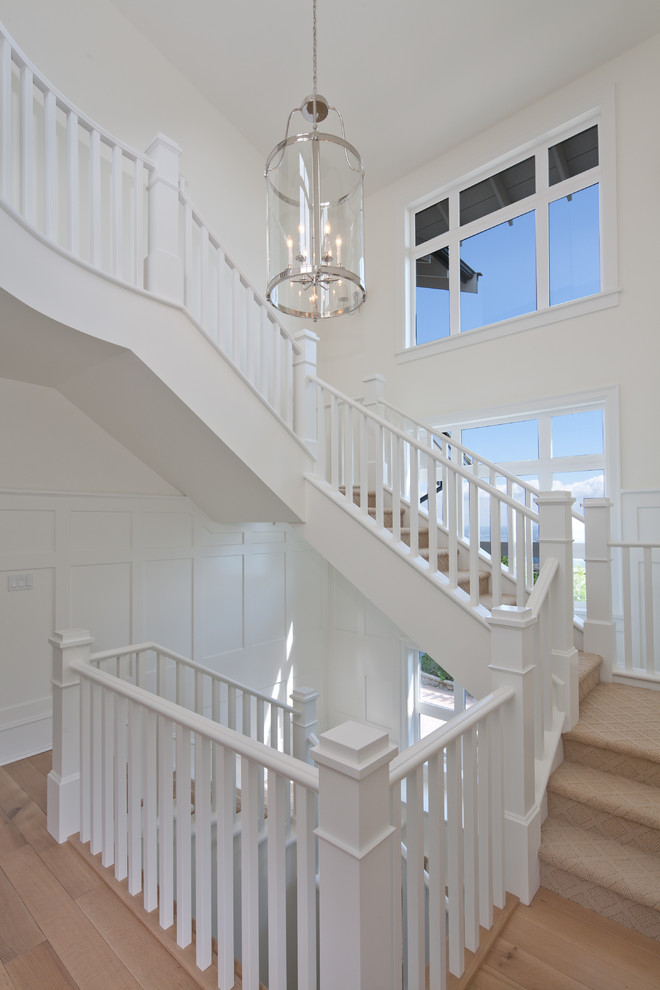 Design ideas for a classic carpeted u-shaped staircase in Vancouver with carpeted risers.