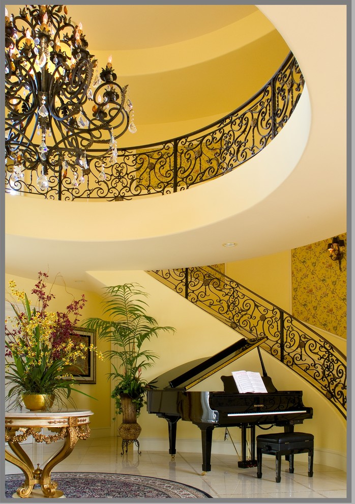 This is an example of a traditional curved staircase in Los Angeles.
