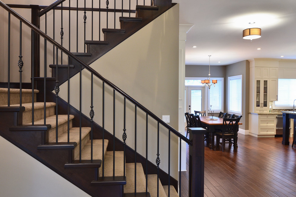 Design ideas for a medium sized traditional carpeted l-shaped staircase in Vancouver with carpeted risers.