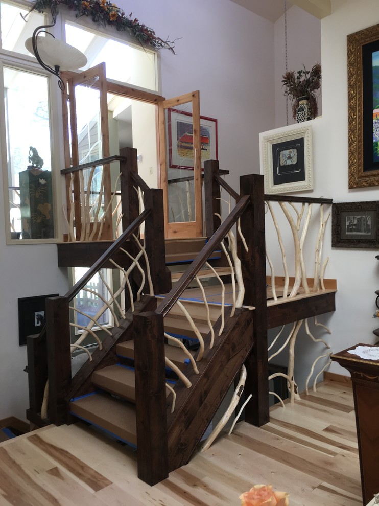 Example of an eclectic staircase design in Denver