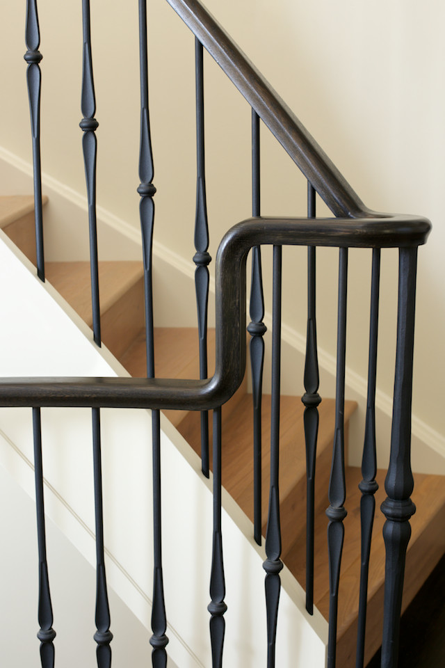 Inspiration for a mediterranean wooden curved mixed material railing staircase remodel in Edmonton with wooden risers