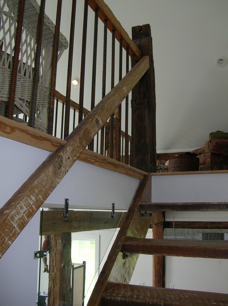 Mid-sized mountain style wooden floating open staircase photo in Boston