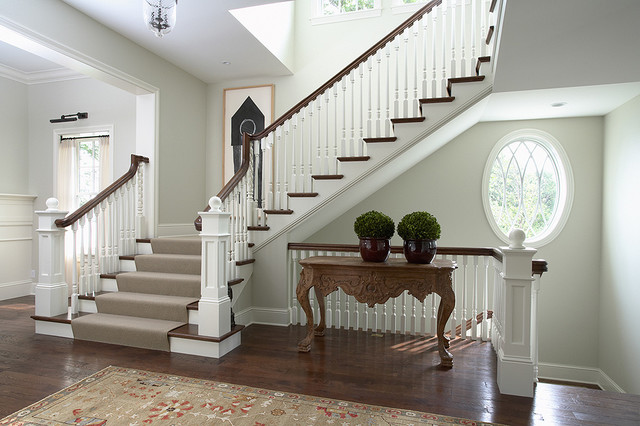Front Entry and Main Staircase with spiral balusters and oval window