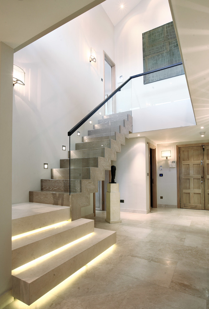 Inspiration for a contemporary wooden l-shaped staircase remodel in London with wooden risers