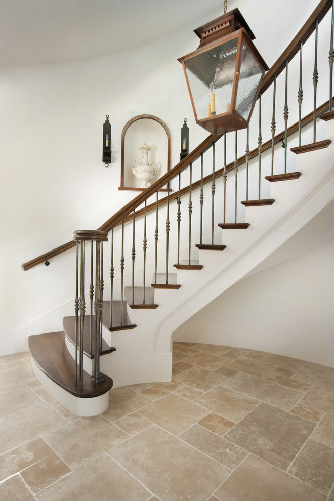 Design ideas for a large mediterranean wood spiral staircase in Other with wood risers.