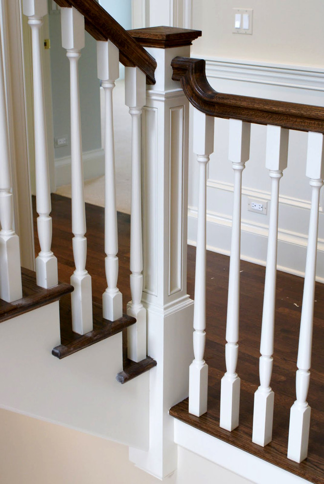 Design ideas for a medium sized classic wood l-shaped staircase in Chicago with painted wood risers.