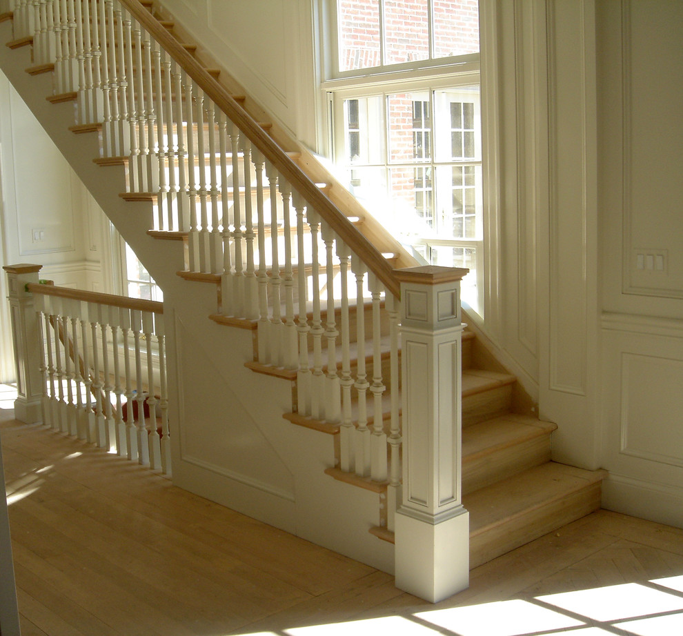 Example of a large classic wooden straight staircase design in Chicago with wooden risers