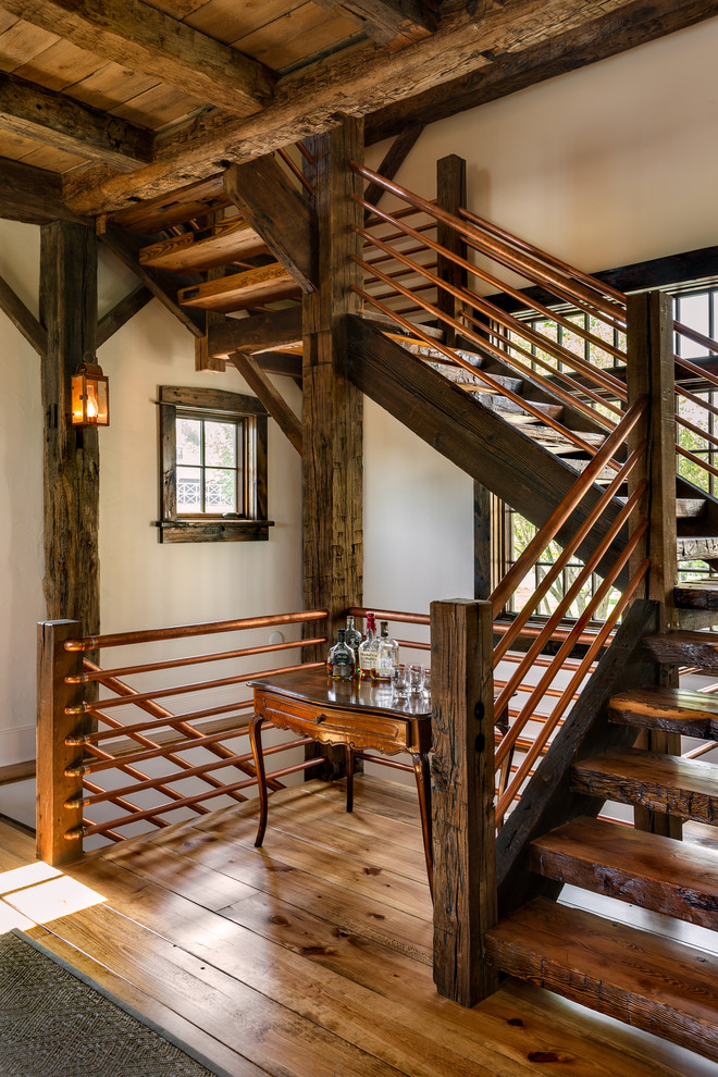 Staircase - rustic wooden open staircase idea in New York