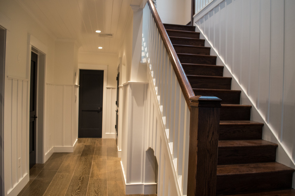 Mid-sized elegant wooden straight staircase photo in Orange County with wooden risers
