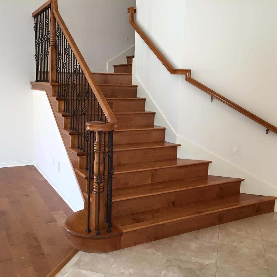 Traditional wood staircase in San Diego with wood risers.