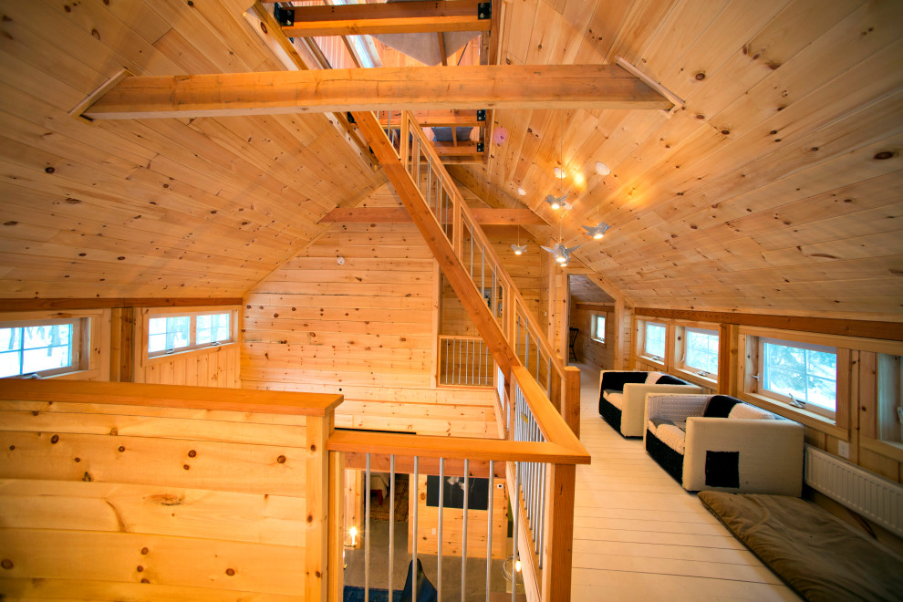 Foto de escalera recta rural sin contrahuella con escalones de madera y barandilla de madera